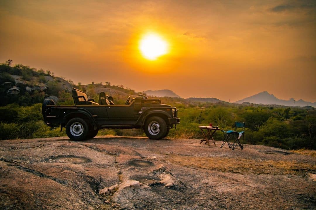 Safari jeep overlooking Jawai at sunset